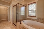 Walk in Shower and Garden Tub with Double Vanities in Master Bath